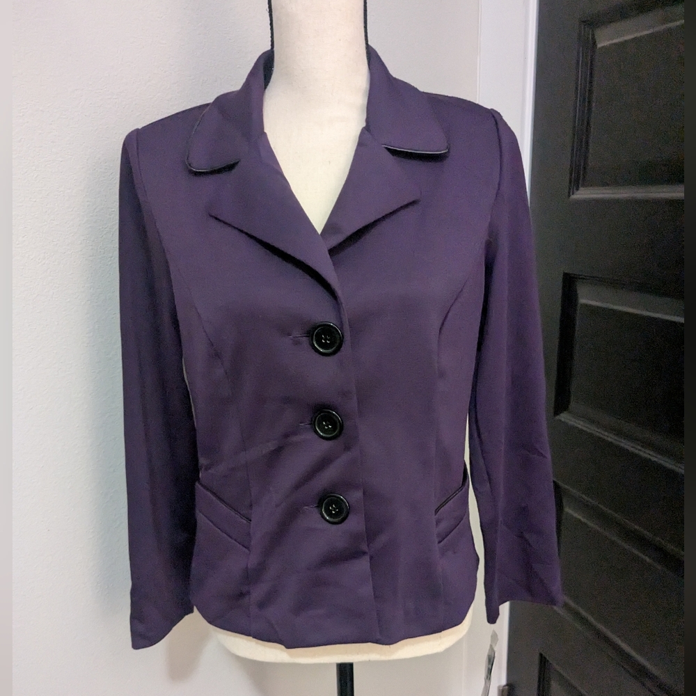 NWT long sleeve purple blazer. Button up front and faux pockets. Washable!